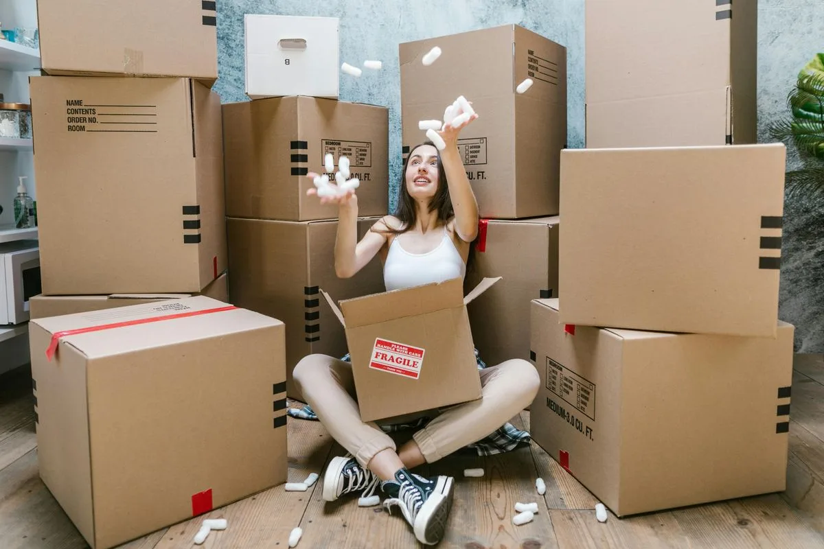 Cardboard moving boxes packed in a room